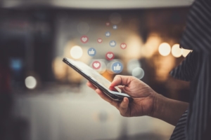 social-media person interacting with a smartphone